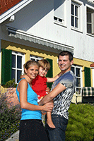 Family infront of new home Family infront of new home